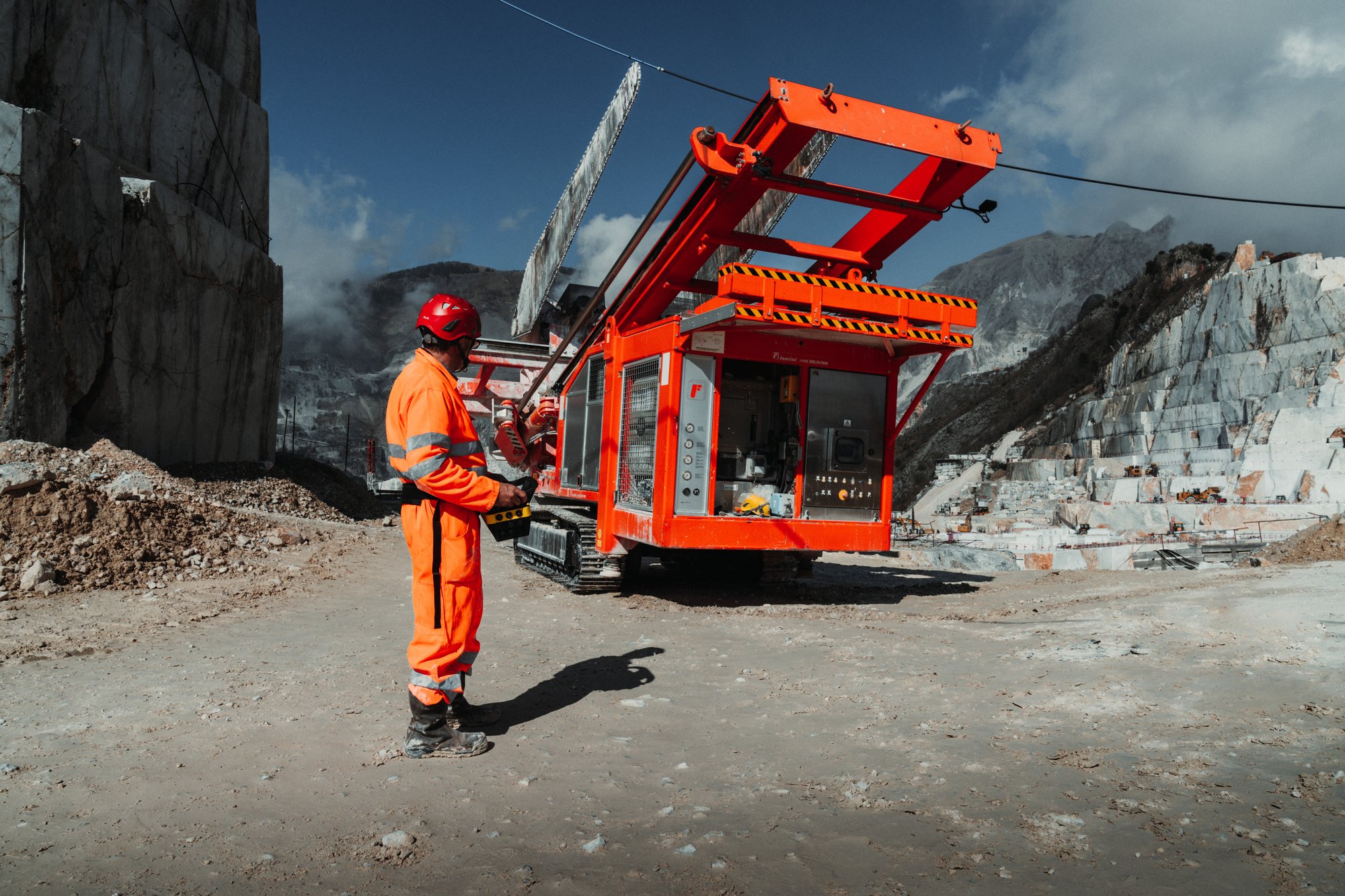 Construction and utilities machine with radio remote control